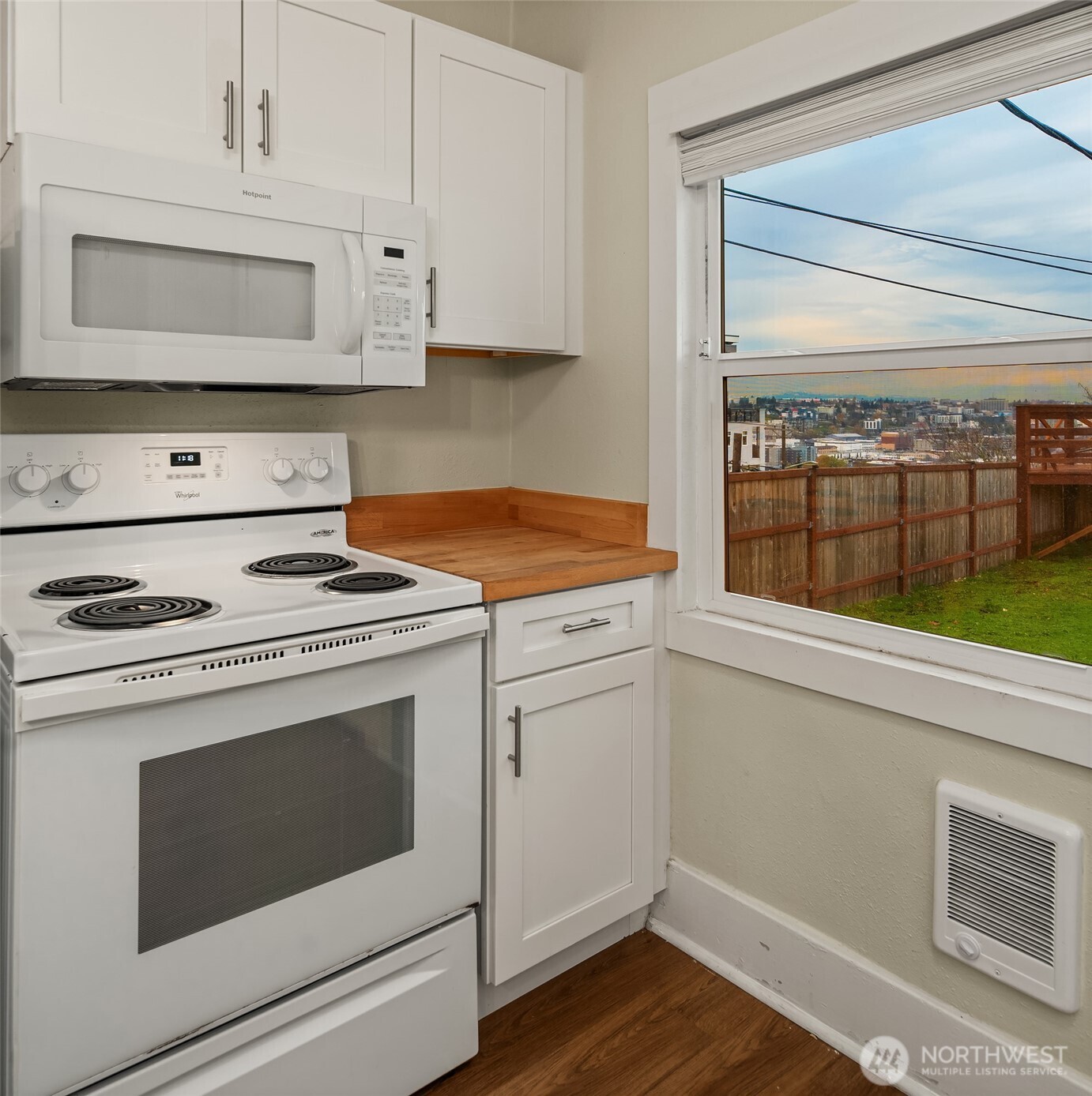 403 East Wright Avenue Tacoma, WA 98404 - Photo 17 of 29 a kitchen with stove cabinets and microwave