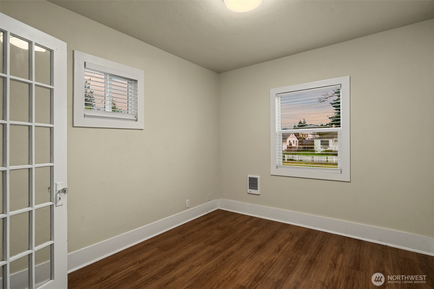 403 East Wright Avenue Tacoma, WA 98404 - Photo 19 of 29 a view of an empty room with wooden floor and a window