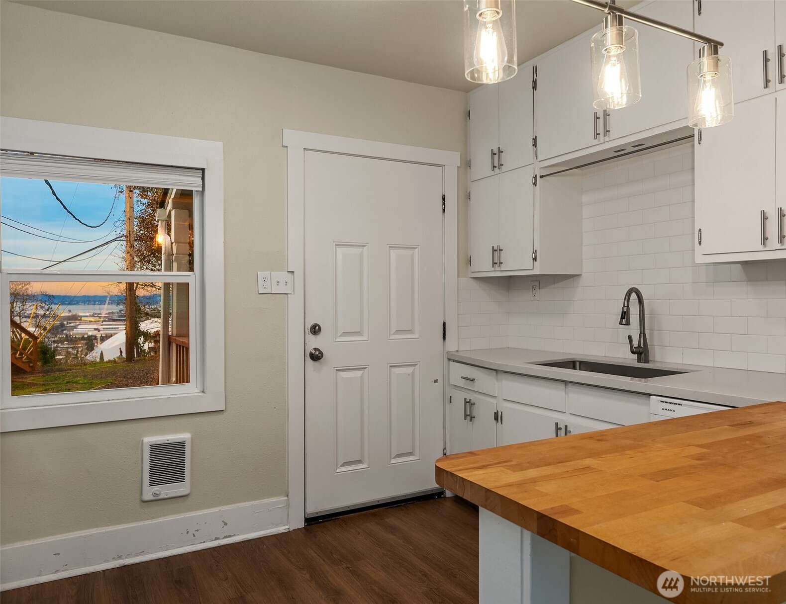 403 East Wright Avenue Tacoma, WA 98404 - Photo 20 of 29 a kitchen with stainless steel appliances granite countertop a sink and wooden cabinets