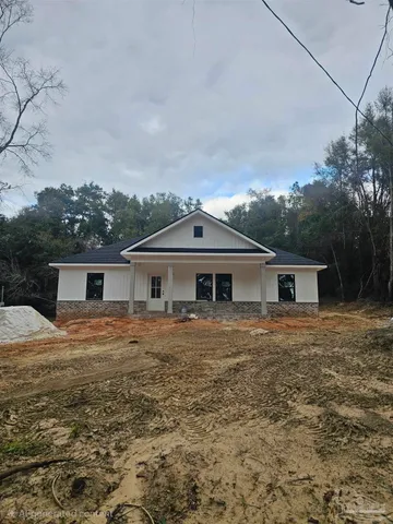 a front view of a house with yard
