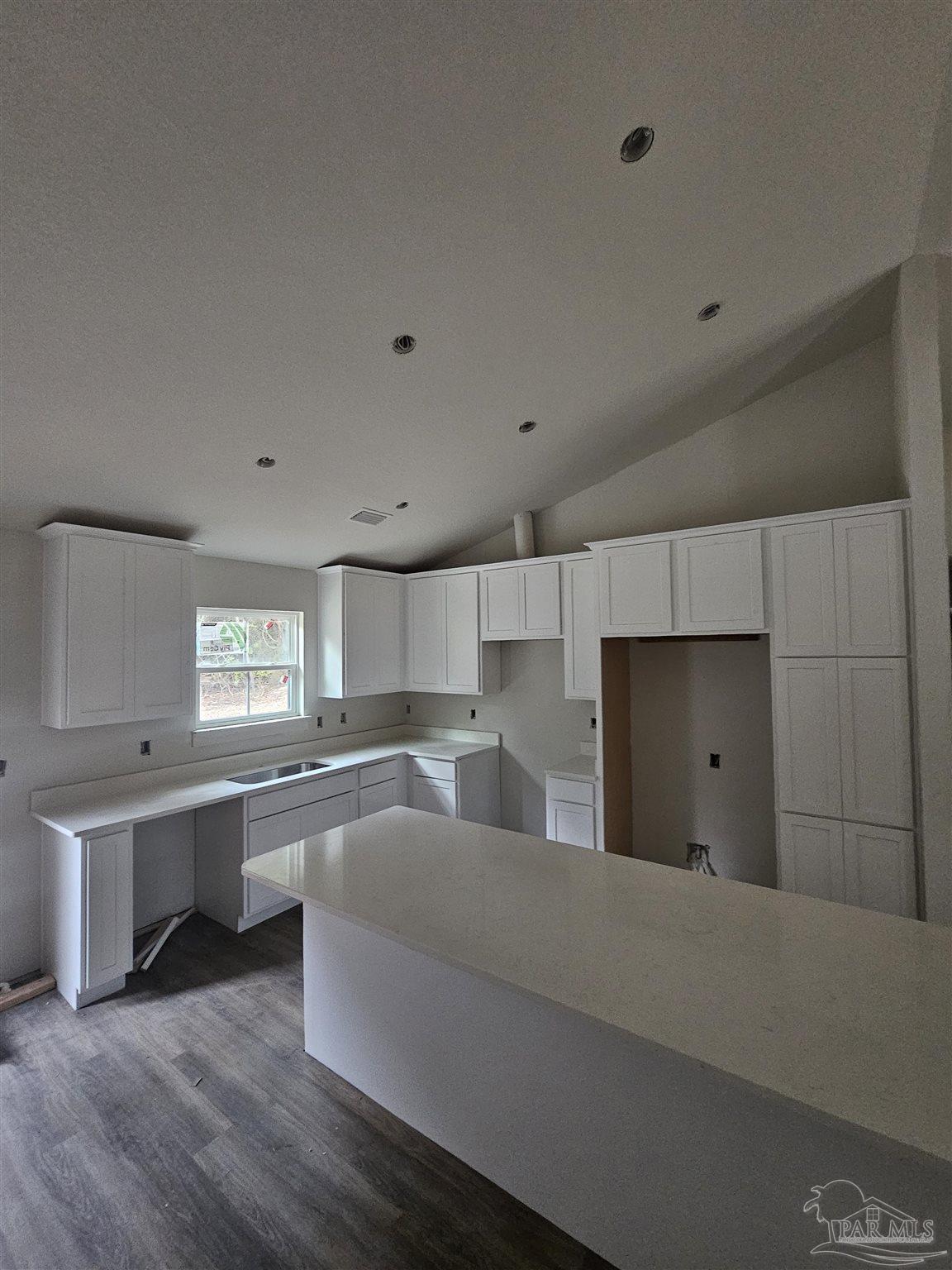 1056 Barth Road Molino, FL 32577 - Photo 3 of 4 a large kitchen with stainless steel appliances a large counter top