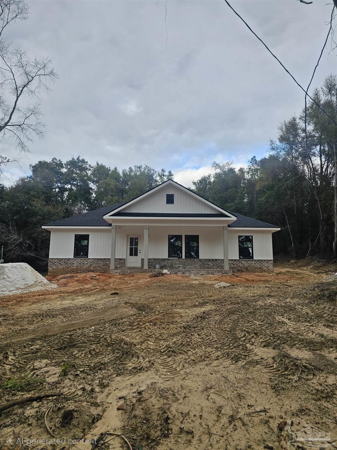 1056 Barth Road Molino, FL 32577 - Photo 4 of 4 a front view of a house with yard