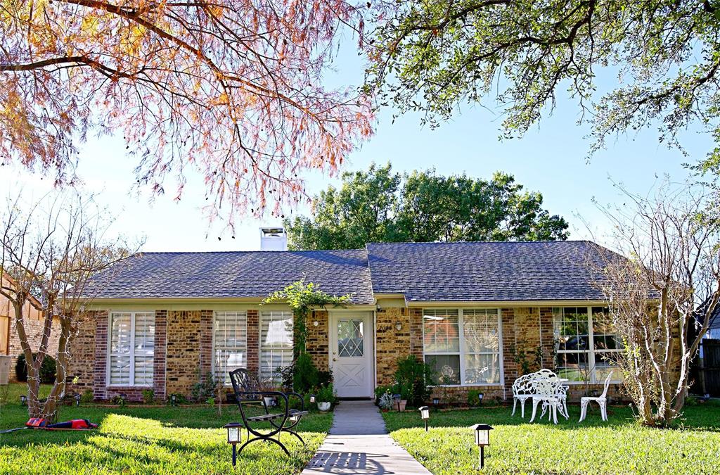 2025 High Bluff Drive Garland, TX 75041 - Photo 1 of 35 a front view of a house with garden