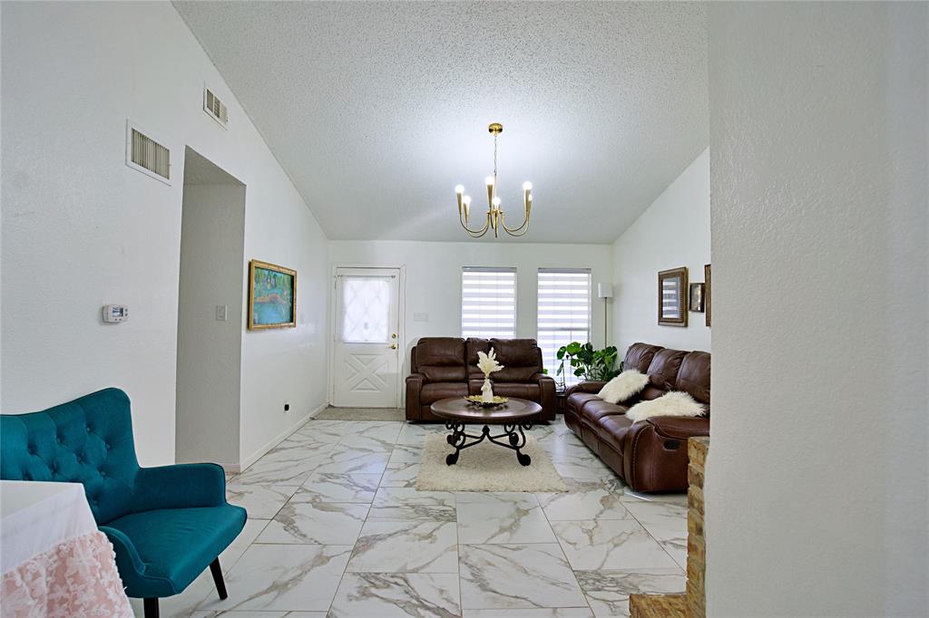 2025 High Bluff Drive Garland, TX 75041 - Photo 14 of 35 a living room with furniture rug and window