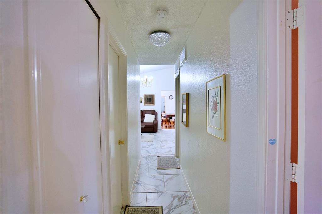 2025 High Bluff Drive Garland, TX 75041 - Photo 24 of 35 a view of a hallway with a view of living room
