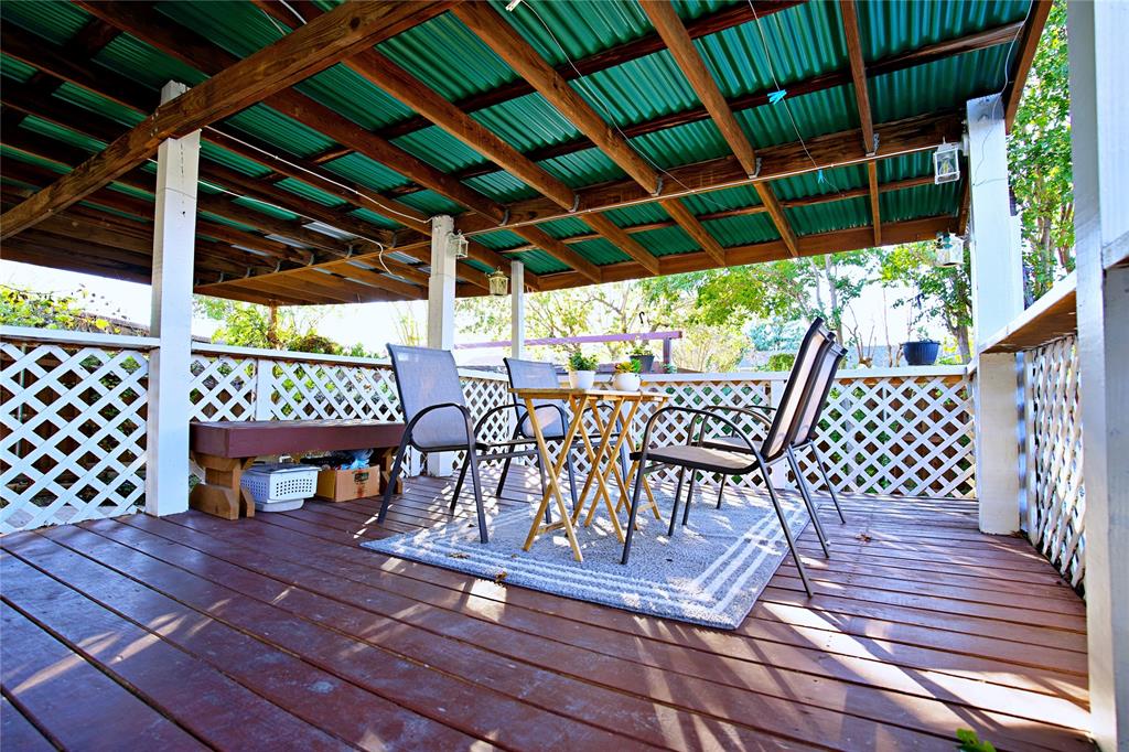 2025 High Bluff Drive Garland, TX 75041 - Photo 25 of 35 a view of a chairs and table on the deck