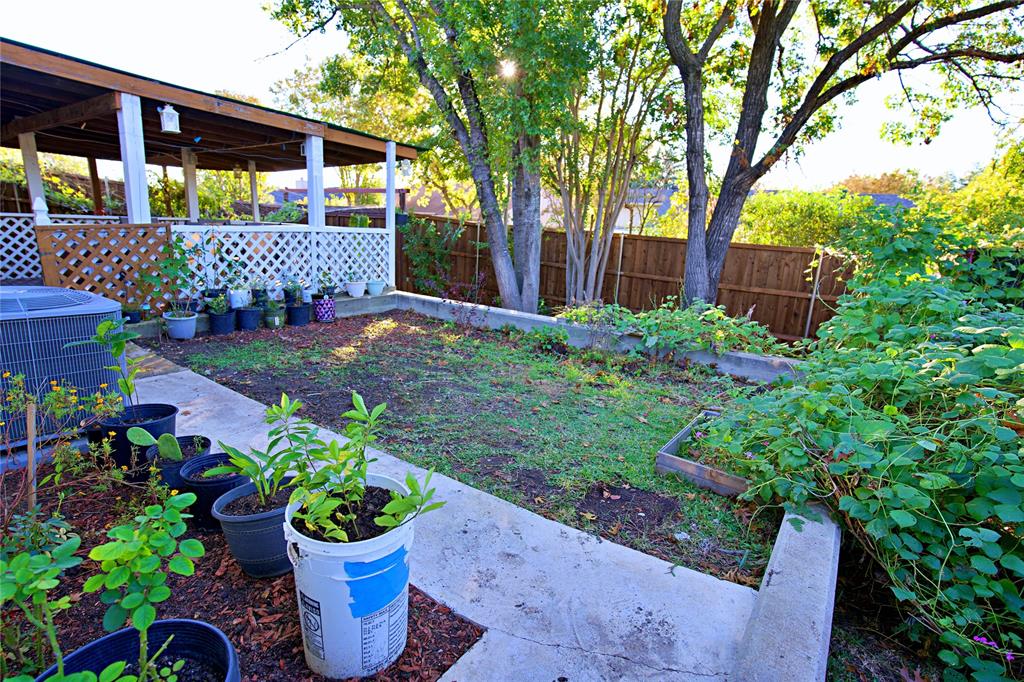 2025 High Bluff Drive Garland, TX 75041 - Photo 28 of 35 a house with lots of trees in front of it