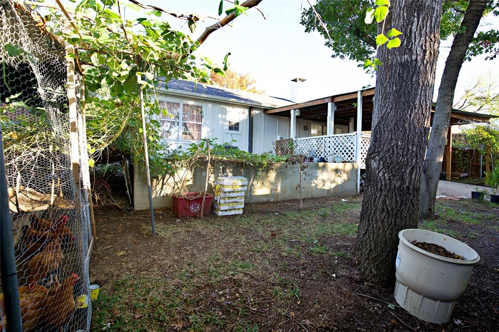 2025 High Bluff Drive Garland, TX 75041 - Photo 32 of 35 a view of a small house with a tree in the yard