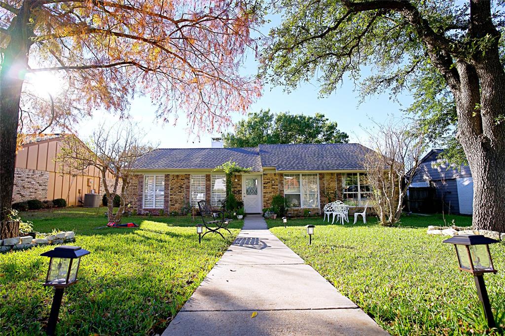 2025 High Bluff Drive Garland, TX 75041 - Photo 4 of 35 a view of a yard in front of a brick house