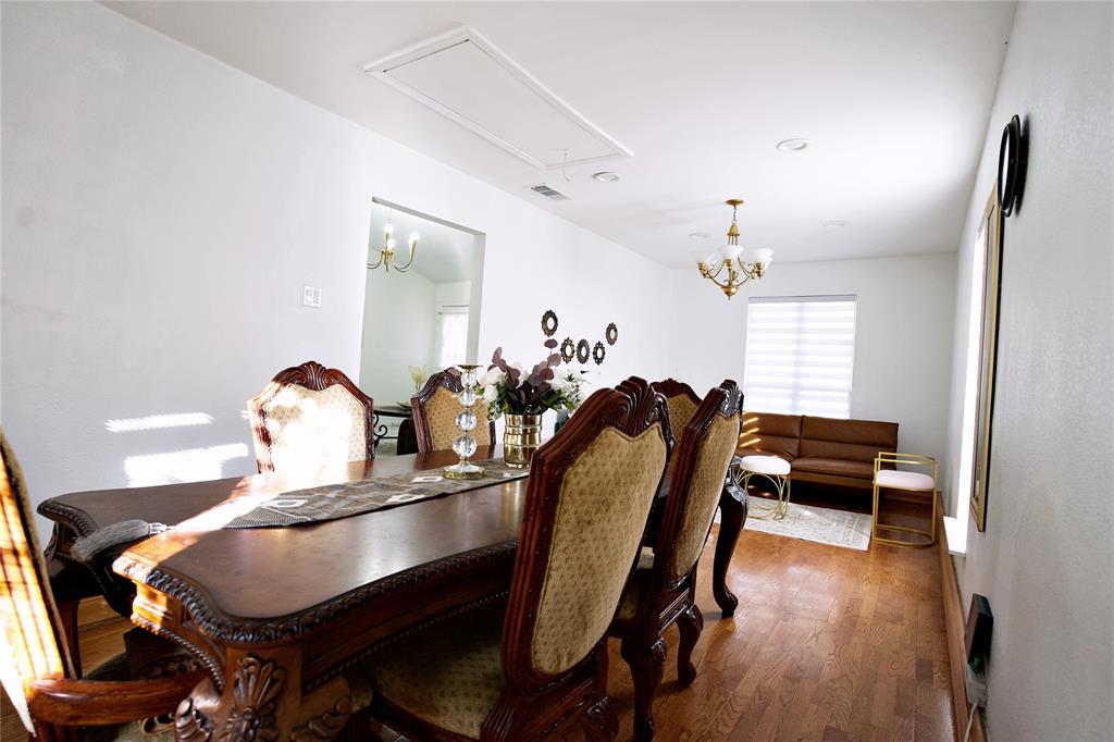 2025 High Bluff Drive Garland, TX 75041 - Photo 8 of 35 a dining room with furniture and wooden floor