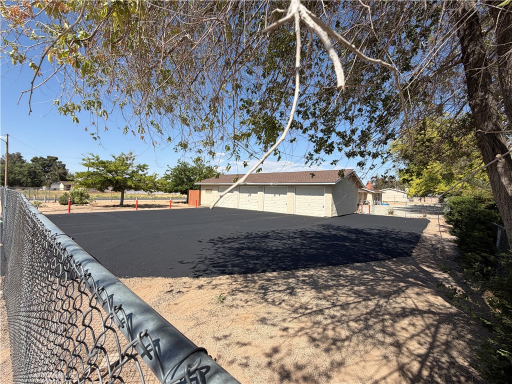 13269 Mohawk Road Apple Valley, CA 92308 - Photo 1 of 8 a view of a yard with wooden fence