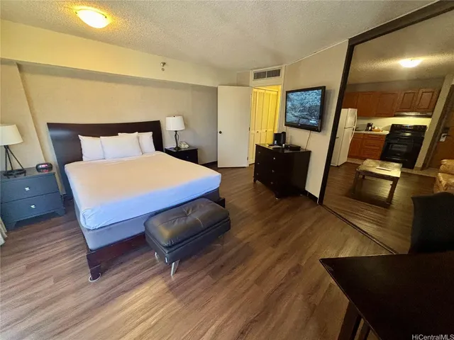 a bed room with a bed window and a mirror