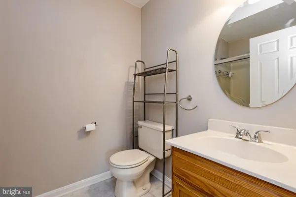 a bathroom with a sink toilet and mirror