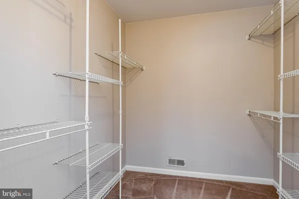 a view of an empty walk in closet