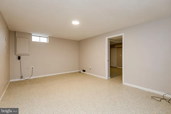 a view of an empty room with stairs