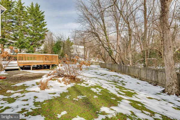 a view of a house with snow on the road