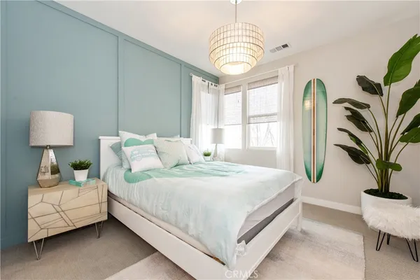 a bedroom with bed and window
