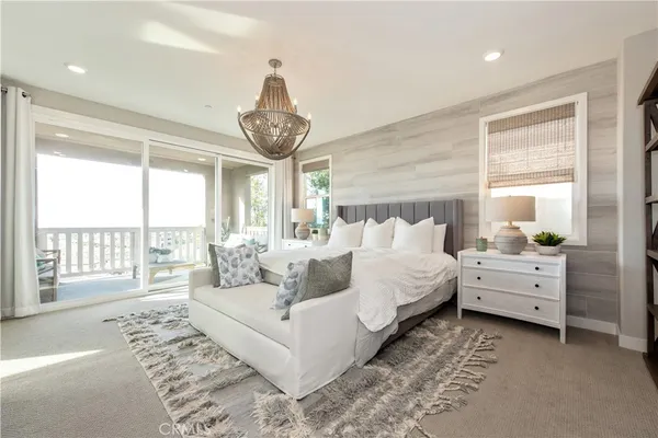 a bed room with furniture and a large window