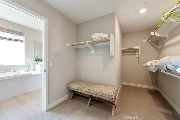 a bathroom with a double vanity sink a mirror and a shower