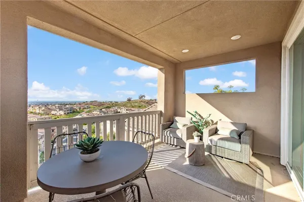 a view of a porch with furniture and outside view