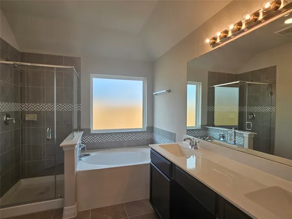 a bathroom with a bathtub and a sink