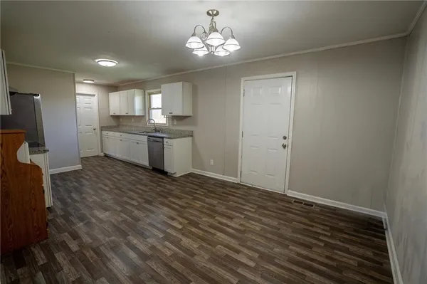 a view of a kitchen from the hallway