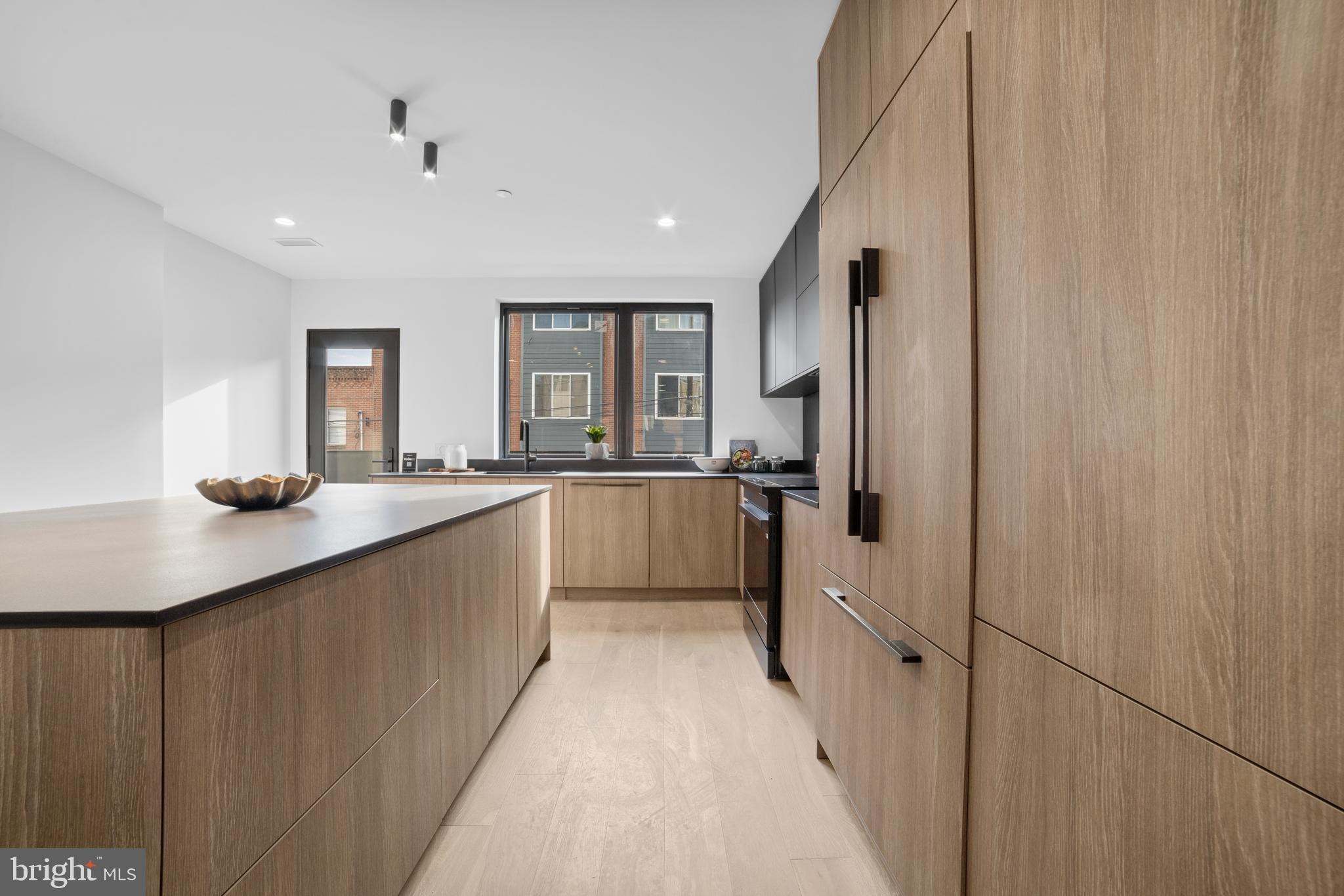 2018 Ellsworth Street Philadelphia, PA 19146 - Photo 11 of 47 a large white kitchen with a sink and dishwasher a refrigerator with white cabinets