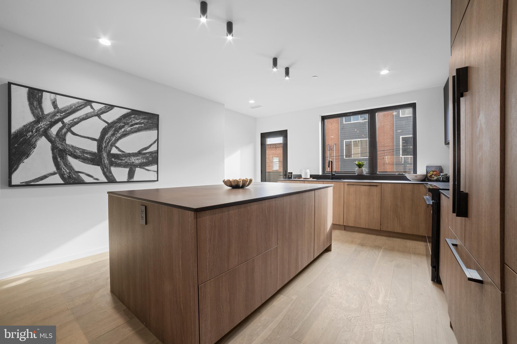 2018 Ellsworth Street Philadelphia, PA 19146 - Photo 12 of 47 a kitchen with stainless steel appliances granite countertop a sink a stove and a refrigerator