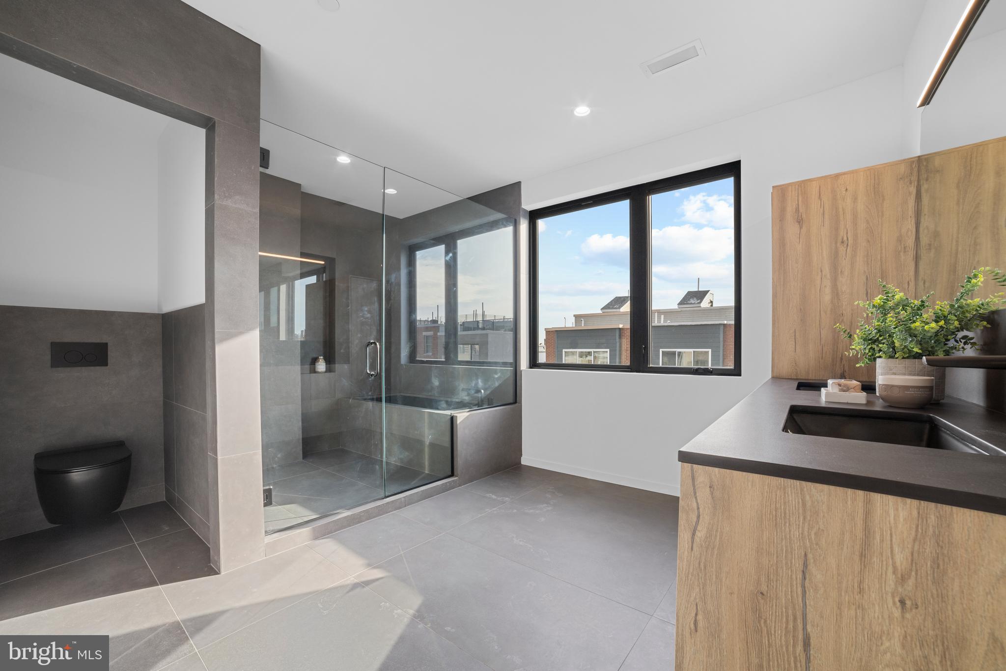 2018 Ellsworth Street Philadelphia, PA 19146 - Photo 22 of 47 a living room with stainless steel appliances granite countertop a refrigerator a sink and a large window