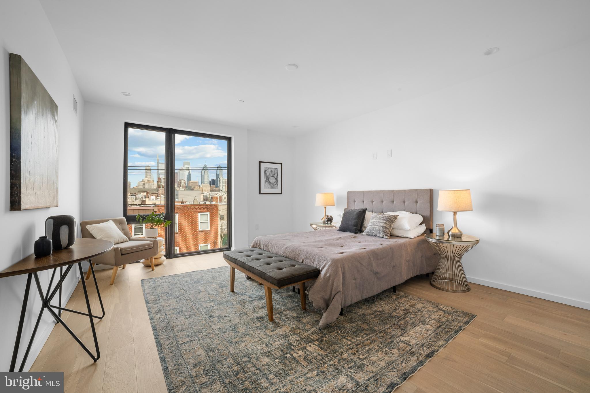 2018 Ellsworth Street Philadelphia, PA 19146 - Photo 26 of 47 a bedroom with a bed and a table