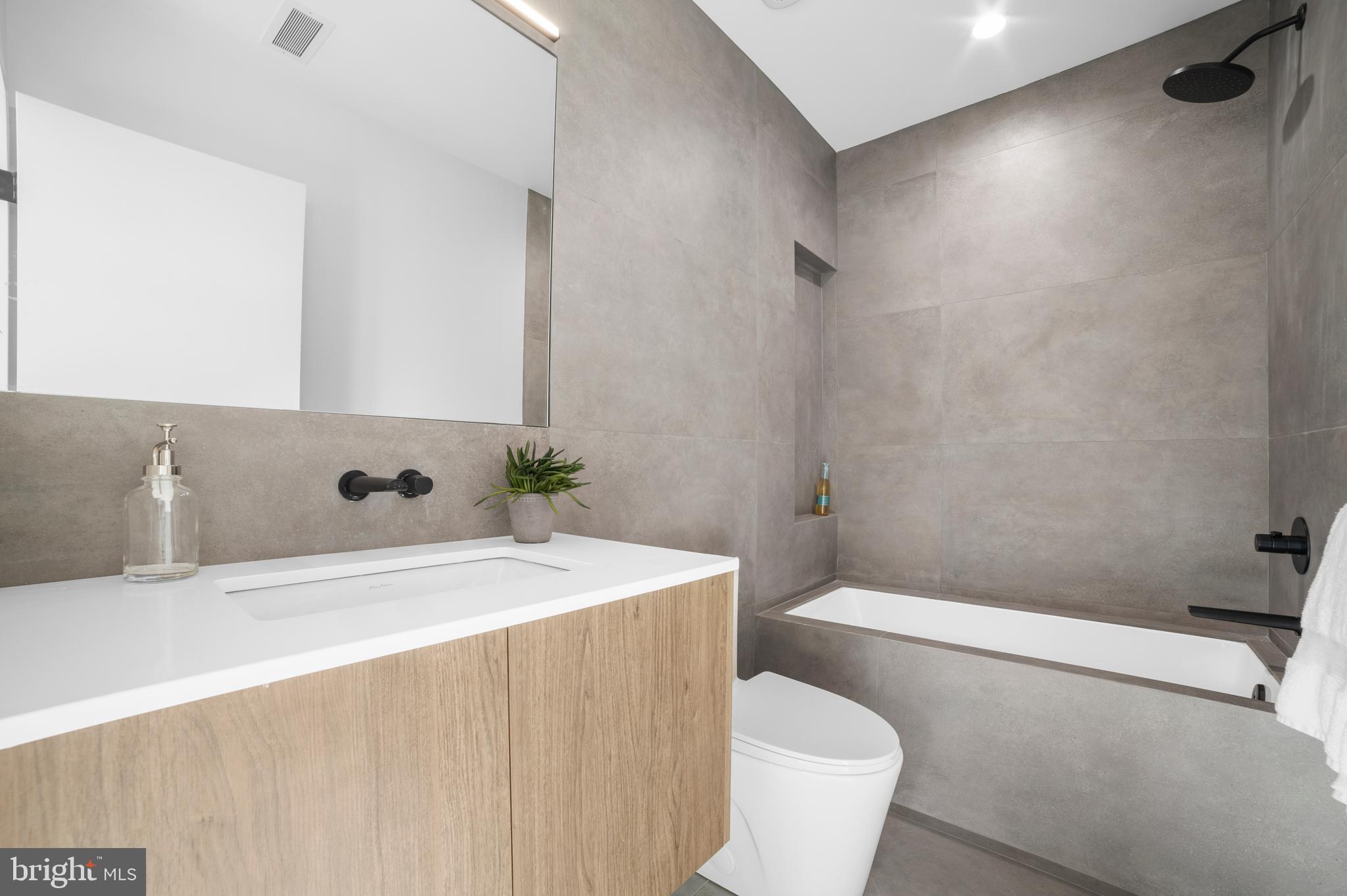 2018 Ellsworth Street Philadelphia, PA 19146 - Photo 30 of 47 a bathroom with a sink a toilet and shower