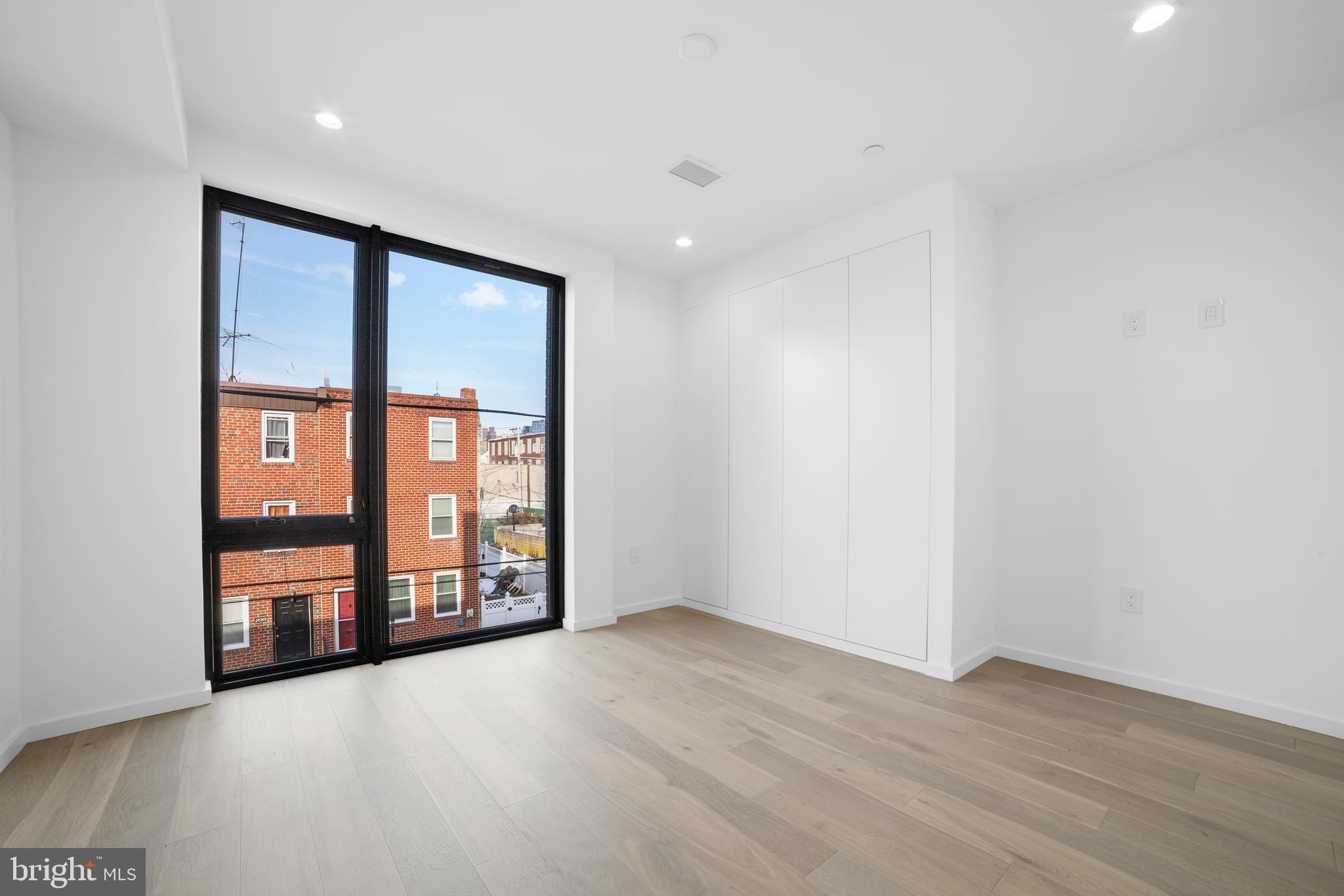 2018 Ellsworth Street Philadelphia, PA 19146 - Photo 36 of 47 wooden floor in an empty room with a window