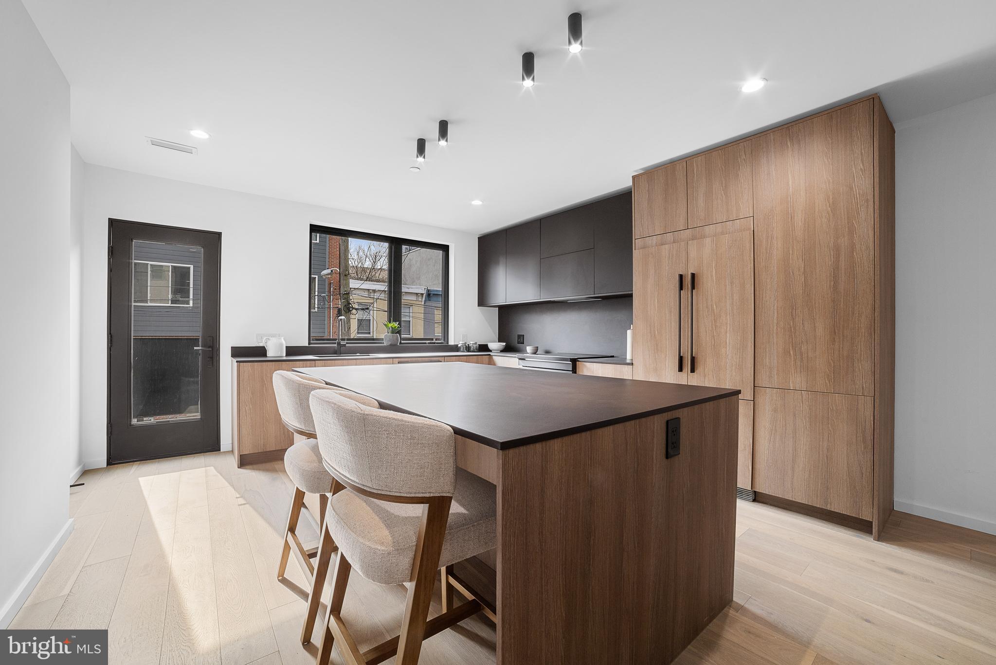 2018 Ellsworth Street Philadelphia, PA 19146 - Photo 6 of 47 a kitchen with stainless steel appliances a kitchen island hardwood floor sink and stove