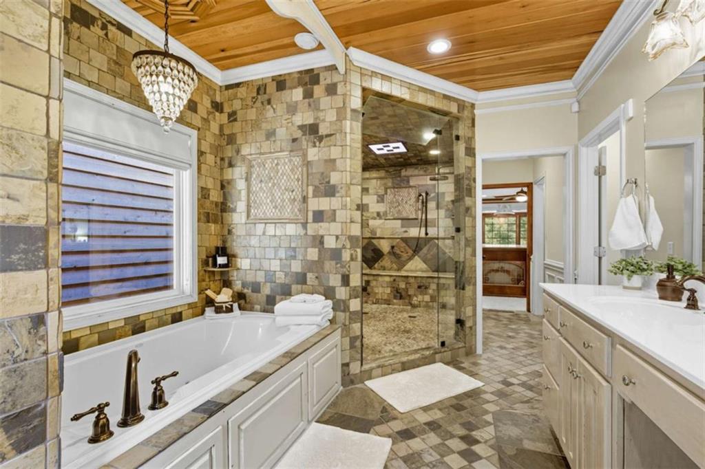 1091 Echota Road Clarkesville, GA 30523 - Photo 21 of 89 a bathroom with a bathtub and a sink