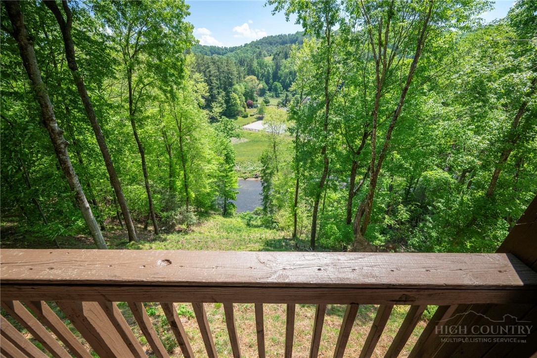 850 River Ridge Road Boone, NC 28607 - Photo 23 of 26 a view of trees and yard from a balcony
