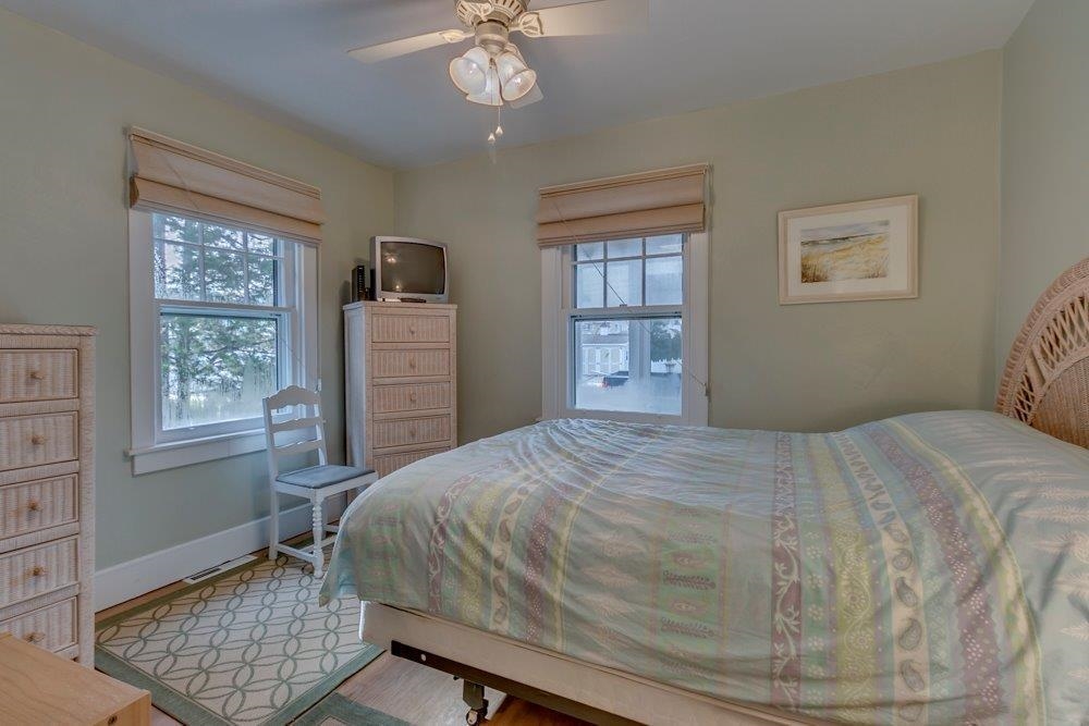 3149 1st Avalon, NJ 08202 - Photo 12 of 20 a bedroom with a bed and a window