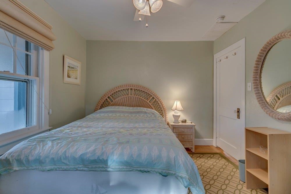 3149 1st Avalon, NJ 08202 - Photo 13 of 20 a bedroom with a bed and a mirror