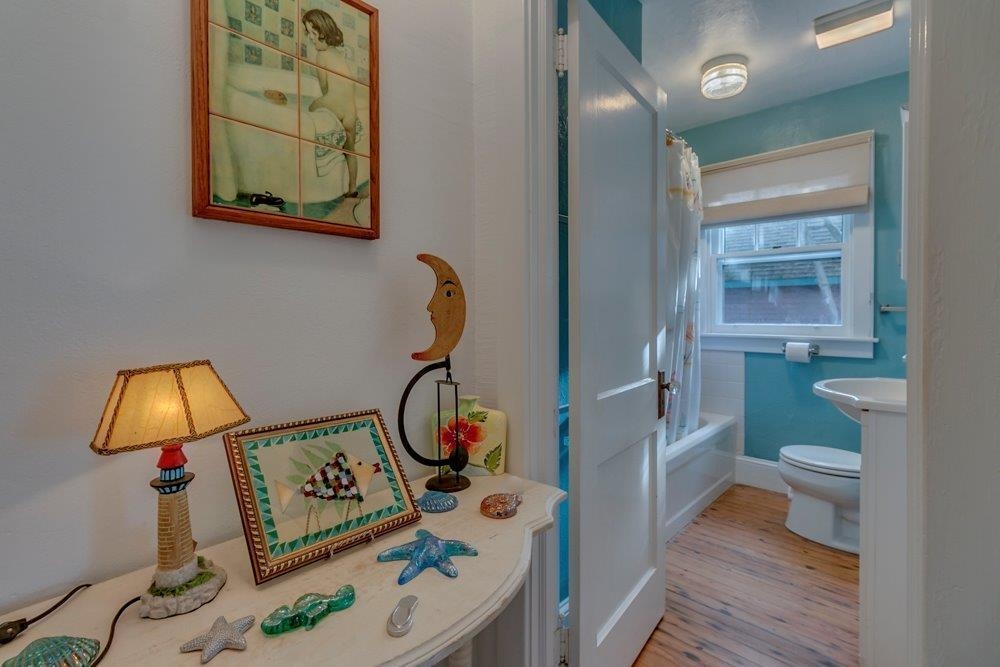 3149 1st Avalon, NJ 08202 - Photo 14 of 20 a bathroom with a toilet a sink and mirror