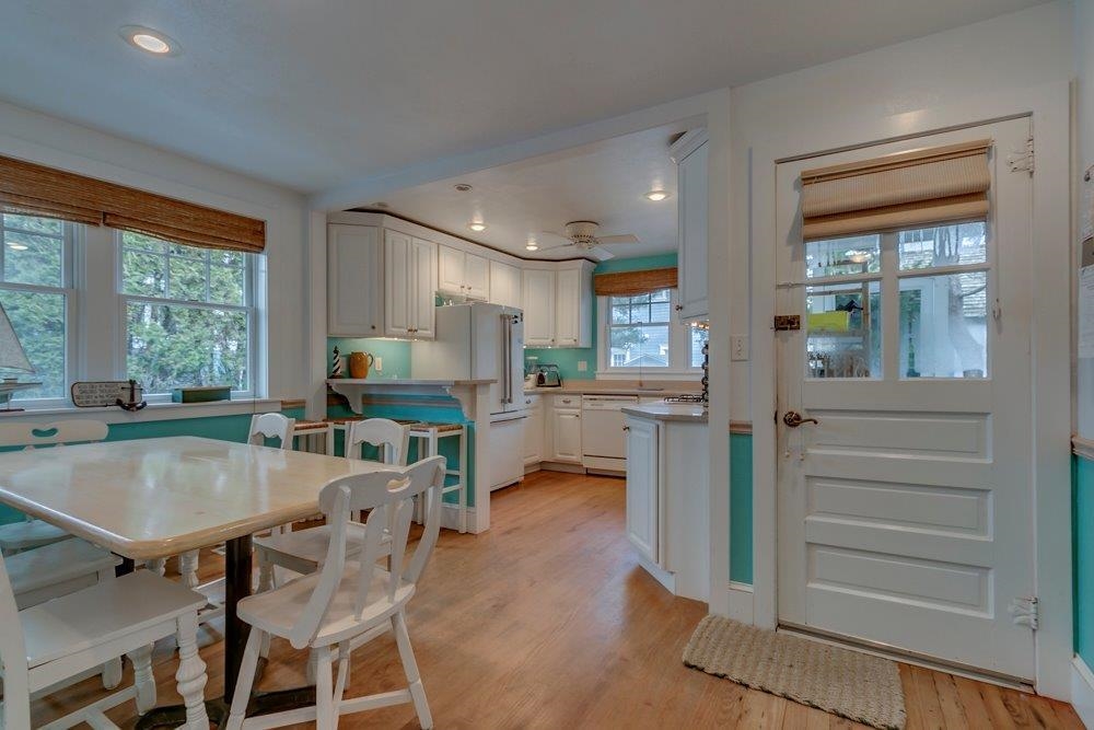 3149 1st Avalon, NJ 08202 - Photo 15 of 20 a kitchen with a table chairs refrigerator and cabinets