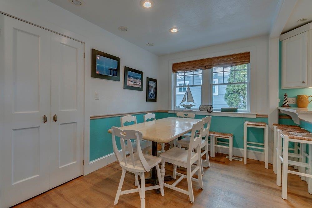 3149 1st Avalon, NJ 08202 - Photo 16 of 20 a view of a dining room with furniture window and wooden floor