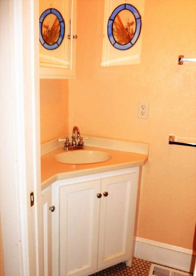3149 1st Avalon, NJ 08202 - Photo 18 of 20 a bathroom with a sink and a mirror