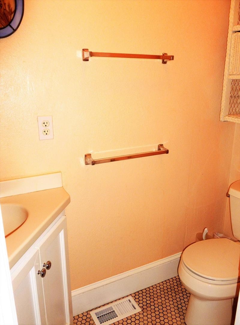 3149 1st Avalon, NJ 08202 - Photo 19 of 20 a bathroom with a toilet and a shower curtain
