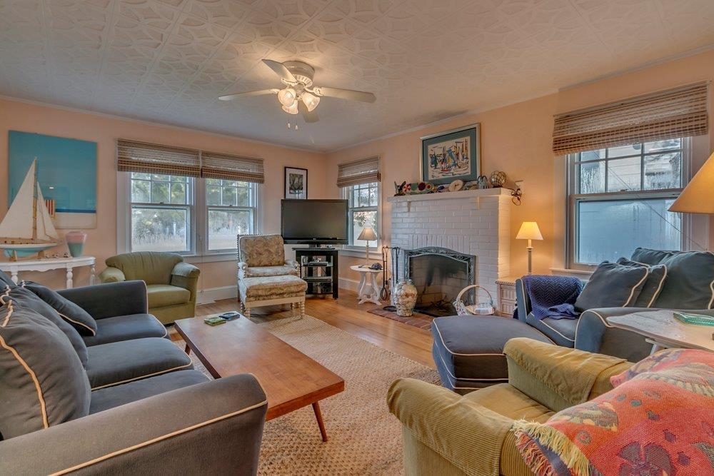 3149 1st Avalon, NJ 08202 - Photo 5 of 20 a living room with furniture a large window and a fireplace