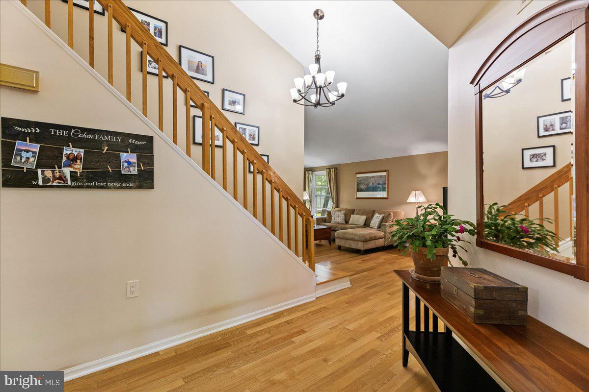 3 Strathmore Place Princeton Junction, NJ 08550 - Photo 4 of 29 a view of a living room with furniture and a chandelier