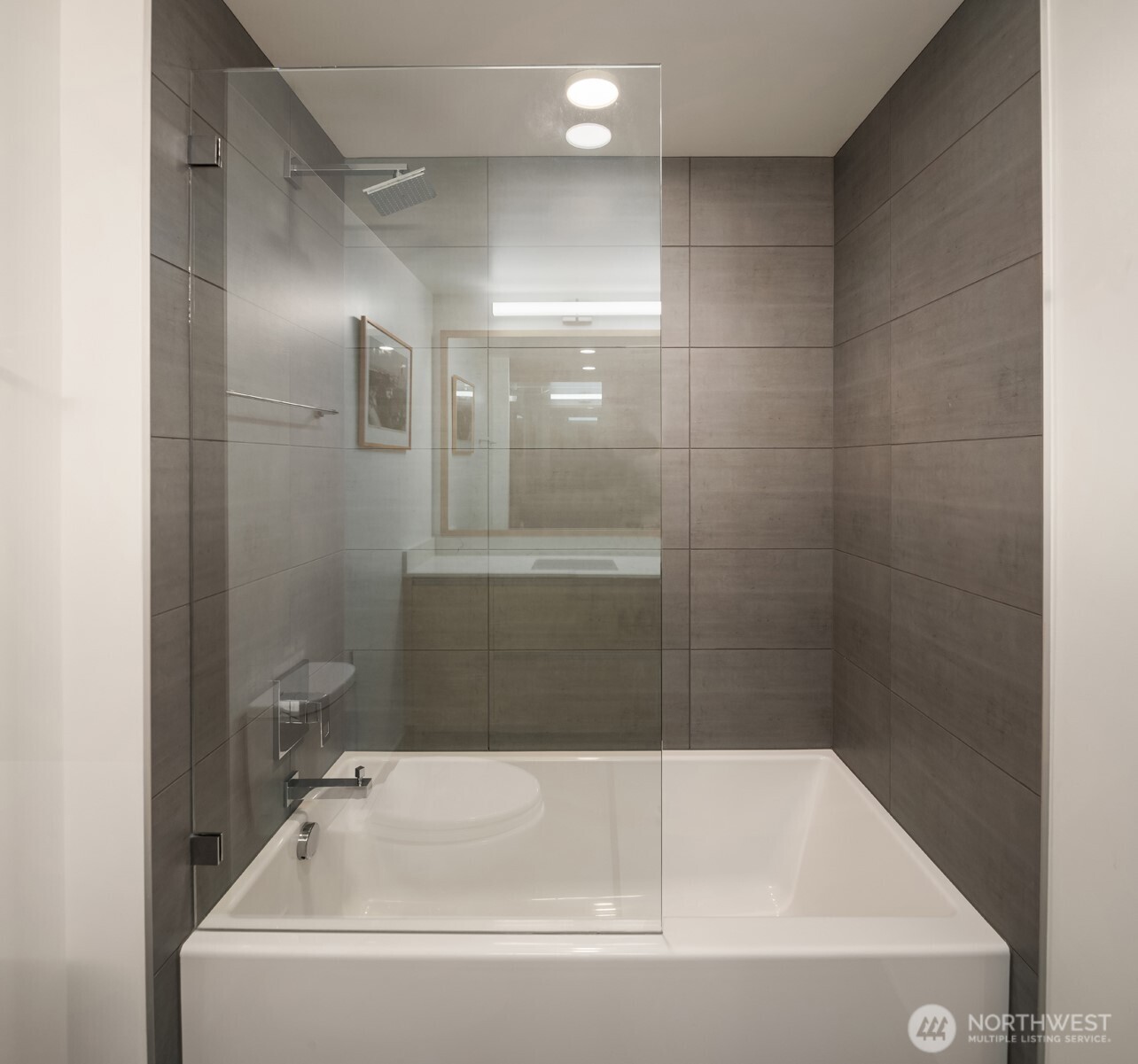 1808 Minor Avenue, Unit 2308 Seattle, WA 98101 - Photo 15 of 36 a bathroom with a bathtub and a shower