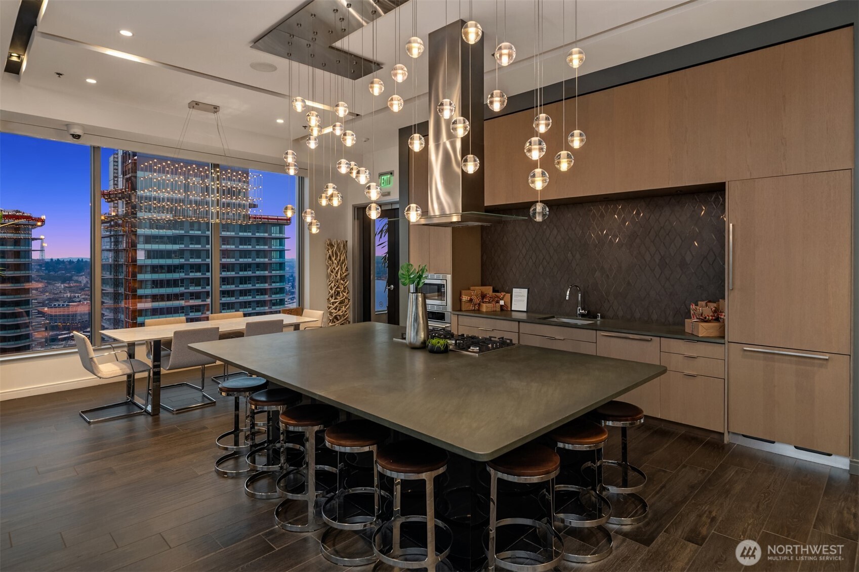 1808 Minor Avenue, Unit 2308 Seattle, WA 98101 - Photo 23 of 36 a kitchen with a table chairs and a refrigerator