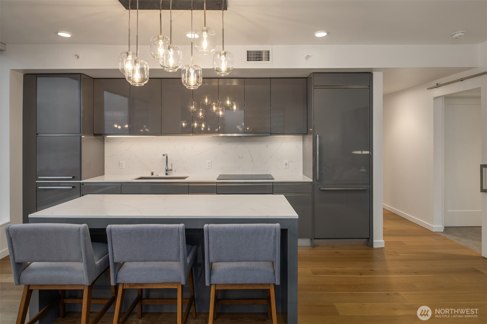 1808 Minor Avenue, Unit 2308 Seattle, WA 98101 - Photo 9 of 36 a kitchen with a table and chairs in it