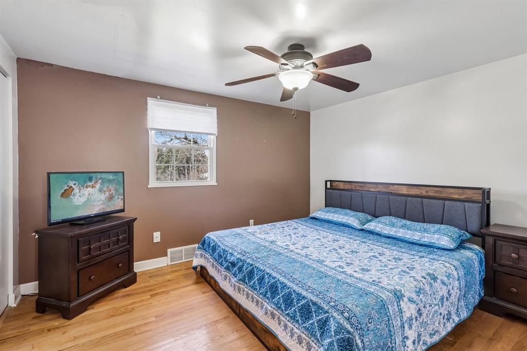 239 Whitestown Village, Unit F Butler, PA 16001 - Photo 16 of 40 a bedroom with a bed and a flat screen tv