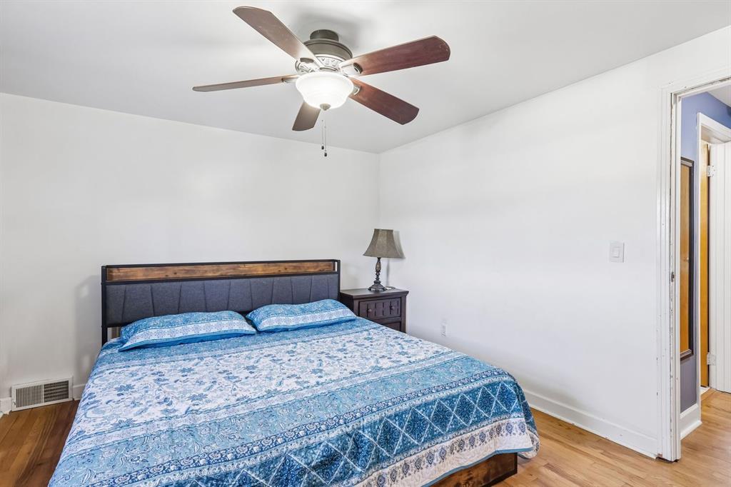 239 Whitestown Village, Unit F Butler, PA 16001 - Photo 18 of 40 a bedroom with a bed and a painting on the wall