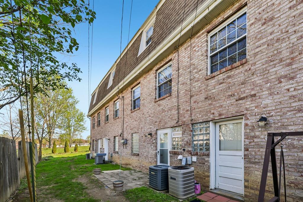 239 Whitestown Village, Unit F Butler, PA 16001 - Photo 32 of 40 a view of a building with a yard